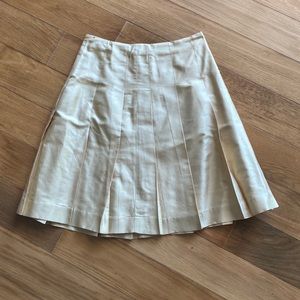 Banana Republic silk pleated skirt. Hits just below knee. Champagne color.
